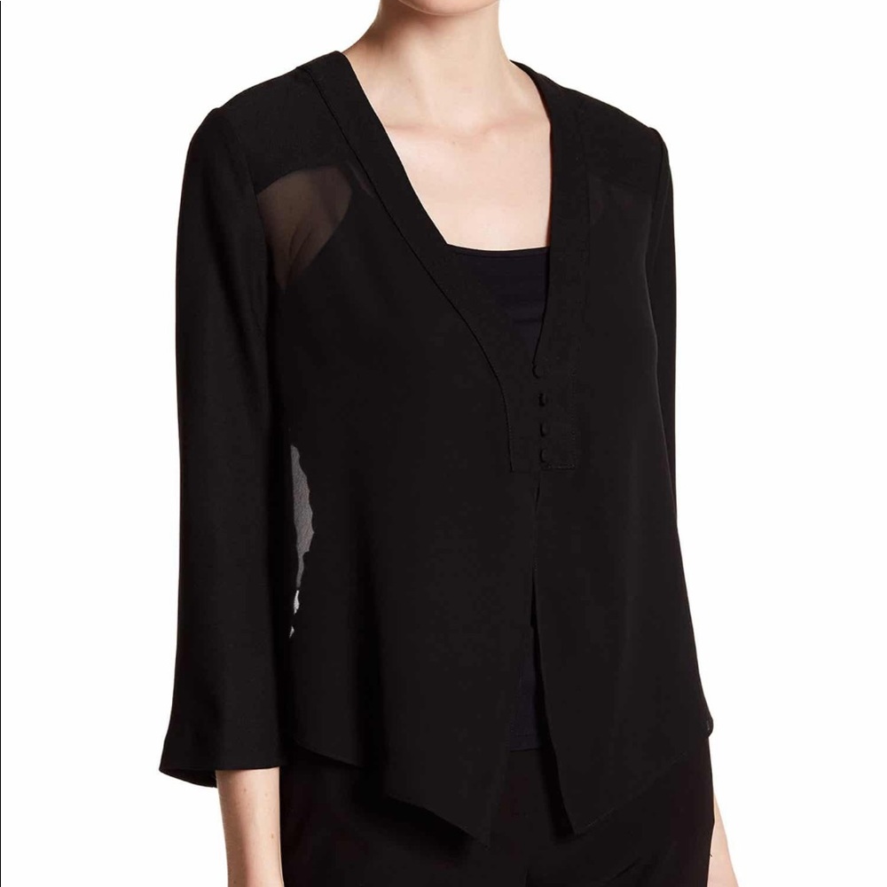 Beautiful black top, with sheer panels